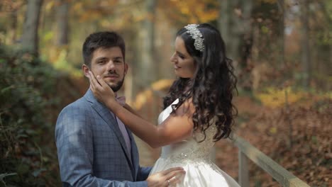 Groom-with-bride-near-mountain-hills-in-the-forest.-Couple.-Making-a-kiss