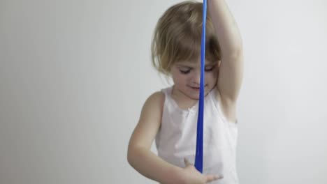 Child-having-fun-making-slime.-Kid-playing-with-hand-made-toy-slime.