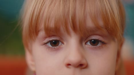 Portrait-Young-Child-Girl-Kid-Looking-at-Camera-Eyes-Close-up-Macro-Looking-To-Camera,-Indoors