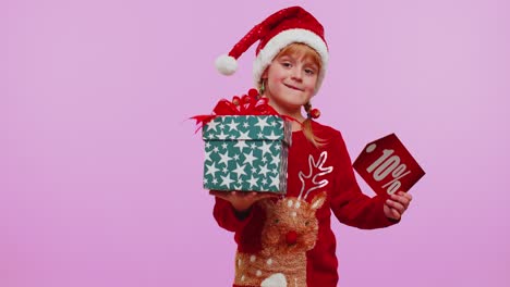 Niña-Pequeña-Con-Sombrero-De-Navidad-Mostrando-Caja-De-Regalo-Y-Nota-De-Texto-De-Banner-De-Inscripciones-De-10-Por-Ciento-De-Descuento