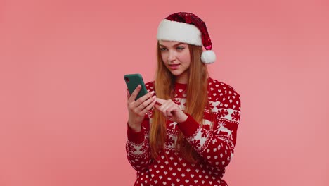 Adult-girl-in-red-Christmas-sweater-looking-smartphone-display-sincerely-rejoicing-win-success-luck