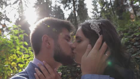 Groom-with-bride-near-mountain-hills-in-the-forest.-Wedding-couple.-Sunbeams