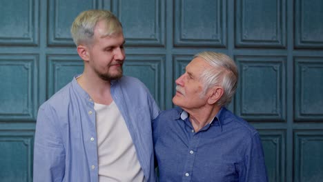 Happy-different-male-generations-family-of-senior-father-and-adult-son-or-grandson-showing-thumbs-up