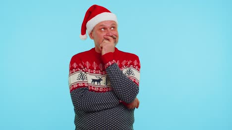 Excited-man-in-Christmas-sweater-make-gesture-raises-finger-came-up-with-creative-plan-good-idea