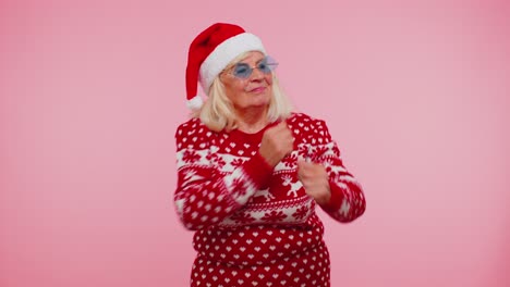 Senior-Christmas-grandmother-woman-with-deer-antlers-listening-music,-dancing-disco,-fooling-around