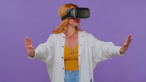 Girl-using-virtual-reality-futuristic-technology-VR-headset-helmet-to-play-simulation-3D-video-game