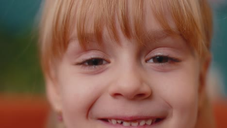 Portrait-Young-Child-Girl-Kid-Looking-at-Camera-Eyes-Close-up-Macro-Looking-To-Camera,-Indoors