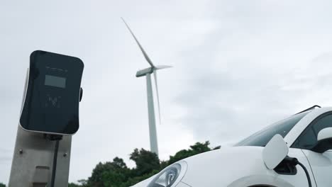 Progressive-combination-of-EV-car,-charging-station-and-wind-turbine.