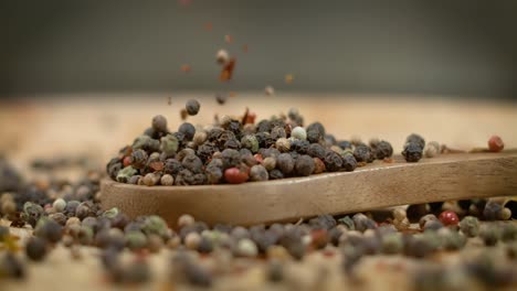 Mixed-peppercorns-in-a-super-slow-motion.-Dry-mix-peppercorns-close-up.