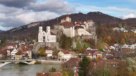 Drone-lifting-shot-of-the-historical-Aarburg-castle-and-church-on-a-sunny-day-in-Switzerland