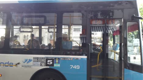 Buses-Drive-By-Rivadavia-Street-Buenos-Aires-City-Argentina-Taxis-Cars,-Houses-at-Daylight