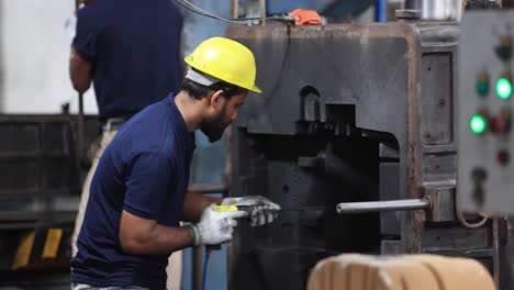 pov-checking-inside-mold-with-worker-are-drill-at-machine