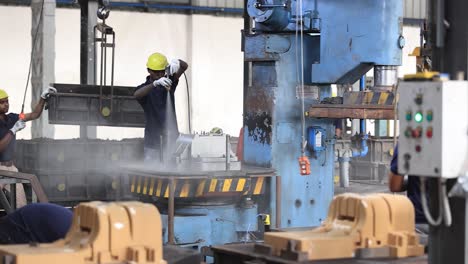 POV-SHOT-Worker-doing-silver-color-is-watching-send-casting-factory