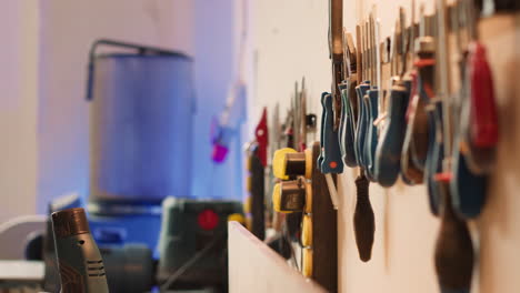 Close-up-of-woodworking-gear-on-rack-in-joinery-and-power-tool