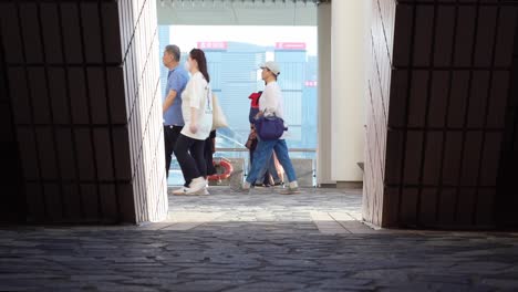 Tourists-at-Hong-Kong-Cultural-Centre,-Tsim-Sha-Tsui