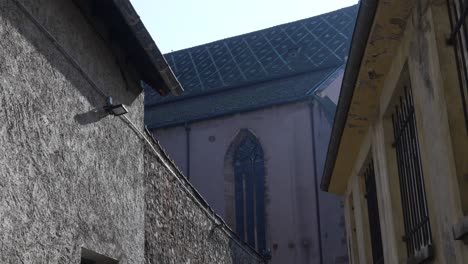 Backside-of-the-Saint-Joseph-church-with-urban-building-walls-in-the-foreground