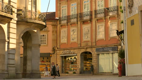 People-At-The-Typical-Street-Scene-With-Historic-Architecture-In-The-Old-Town-Of-Braga,-Portugal