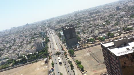 Aerial-drone-view-is-moving-towards-the-front,-big-buildings-are-visible