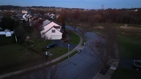 Amazon-Prime-delivery-van-driving-in-American-neighborhood-at-night