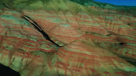 Aerial-view-Petra,-Jordan,-Middle-East-Drone-camera-moving-backwards-where-heels-and-mountains-are-visible-in-pink-color