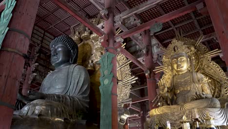 Looking-Up-At-The-Great-Buddha-Next-To-Nyoirin-Kannon-At-Todaiji-Temple-In-Nara