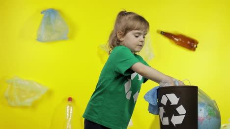 Girl-activist-in-cellophane-packages-on-her-neck-makes-Earth-globe-free-from-plastic-package