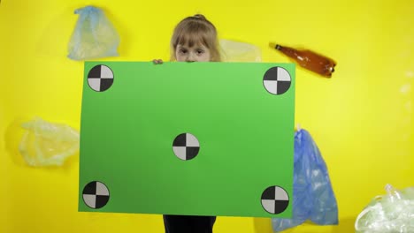 Girl-activist-holding-chroma-key-poster-with-tracking-points.-Environment-trash-plastic-pollution