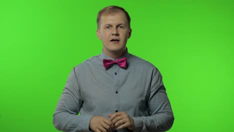 Expressive-man-screaming-and-shouting.-Studio-portrait-of-handsome-person-on-chroma-key