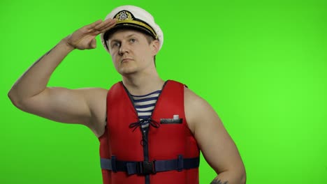 Young-muscular-sailor-man-works-as-lifeguard-at-beach-observe-the-territory