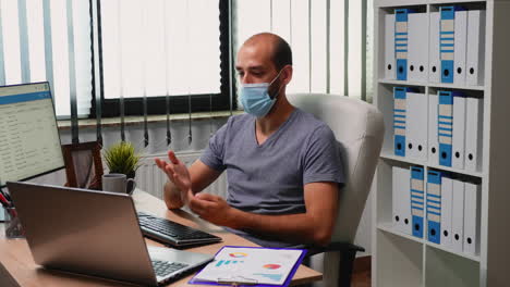 Man-using-laptop-for-video-meeting