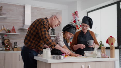 Family-cooking-traditional-gingerbread-delicious-dessert-preparing-cookies-shape