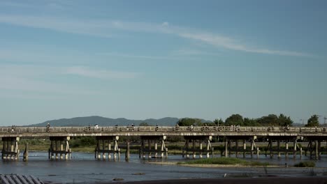 Togetsukyo-Bridge-Crossing-Katsura-River-With-Clear-Blue-Skies-Overhead-In-Arashiyama