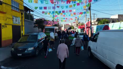 Dolly-in-the-wake-of-a-Day-of-the-Dead-procession-in-Iztapalapa,-Mexico-City