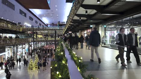 Inside-The-Turbine-Hall-At-Battersea-Power-station-During-Festive-Christmas-Period-With-Shoppers-Walking-Past