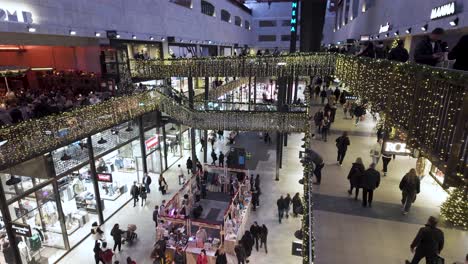 Inside-The-Turbine-Hall-At-Battersea-Power-Station-During-Festive-Christmas-Period-With-Shoppers-Walking-Past