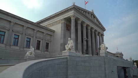 People-Walking-Around-Stairs-of-Austrian-Parliament