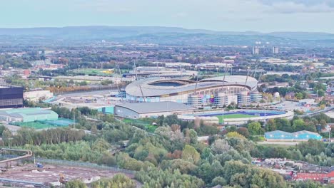 Drone-lifting-shot-of-the-Etihad-stadium-of-Manchester-City-at-daylight