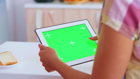 Browsing-on-tablet-computer-with-green-screen