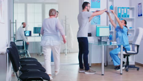 Young-man-filling-documents-in-hospital-waiting-area