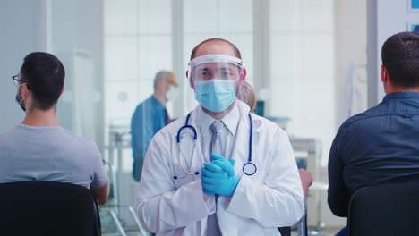 Portrait-of-tired-doctor-with-face-mask-and-visor