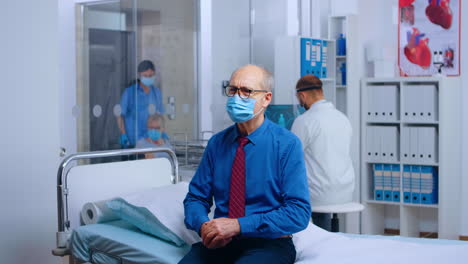 Old-man-wearing-mask-at-doctor-appointment