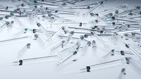 A-pile-of-used-generic-plastic-disposable-syringes.-Medical-waste.-Empty-clear-plastic-syringes.-Close-up-on-the-needle.-Concept-of-health,-medication,-drug-addiction,-diabetes,-vaccination.-4K