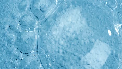 Oxygen-bubbles-in-water-on-a-blue-abstract-background-on-super-slow-motion.