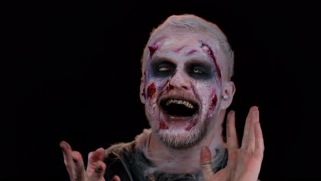 Erschreckender-Mann-Mit-Halloween-Zombie-Make-up,-Der-Kopfhörer-Trägt-Und-Musik-Hört,-Tanzt-Und-Feiert