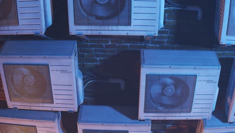 Multiple-old,-rusty-outdoor-air-conditioner-units-on-the-brick-wall.-Camera-moves-upwards-in-endless,-seamless-loop.-Many-units-providing-fresh,-cool-air-to-the-citizens.-City-overheat-as-a-result.