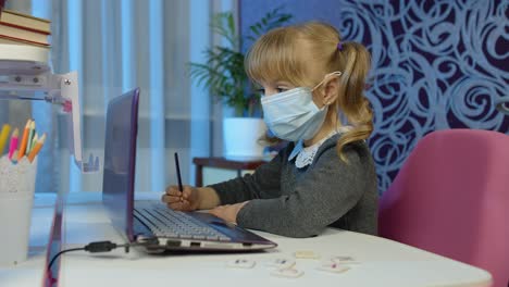 Girl-doing-online-homework-with-teacher,-using-digital-laptop-computer-at-home,-distance-education