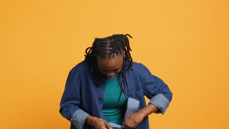 Portrait-of-happy-woman-rummaging-through-backpack,-looking-for-school-notebook