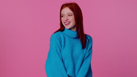 Cheerful-lovely-teenager-student-girl-fashion-model-in-blue-sweater-smiling-and-looking-at-camera