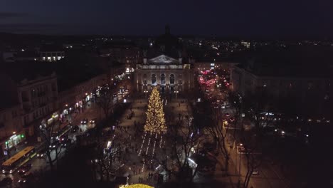 Christmas-tree,-Fair-market,-aerial-view-in-city-center-at-winter,-New-Year-2021-in-Lviv,-Ukraine