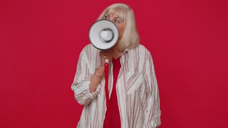 Smiling-senior-woman-talking-with-megaphone-proclaiming-news-loudly-announcing-sale-advertisement